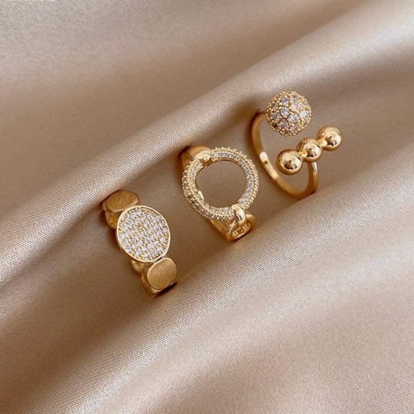A three-piece ring set, each ring with a different and elegant design.